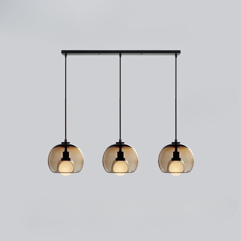 Orbis pendant light with Nordic-inspired glass design casting warm ambient glow for modern interiors