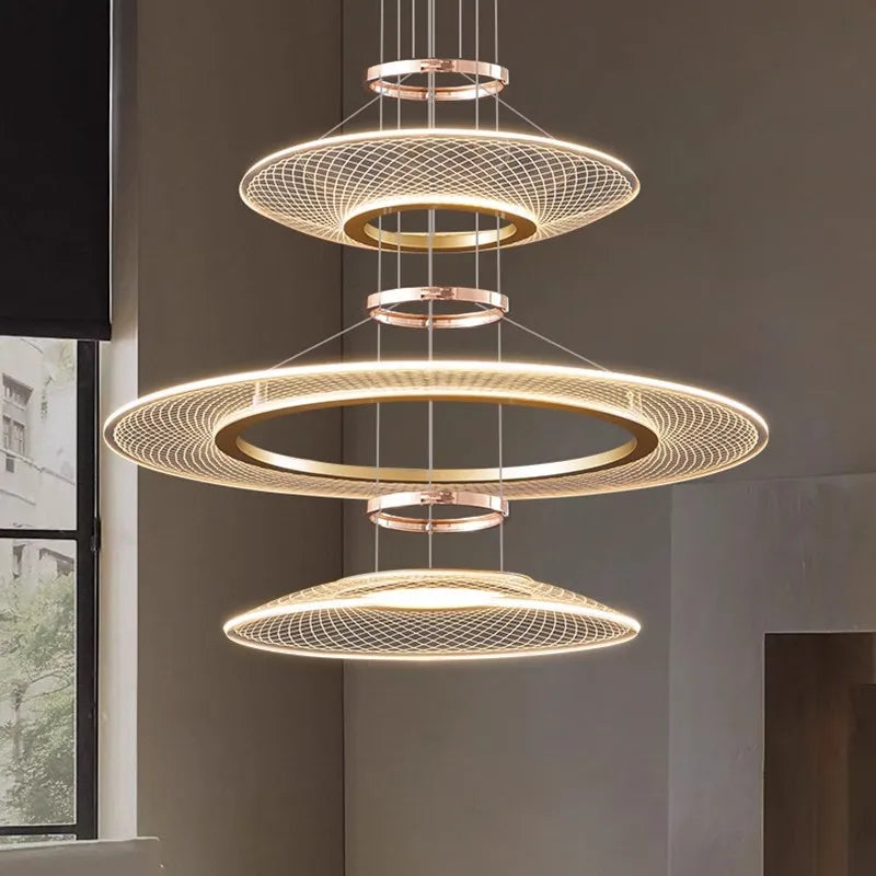 Dröme modern LED chandelier with sculptural acrylic rings and soft ambient glow, Nordic-style ceiling light ideal for living rooms, bedrooms, stairwells, and hotel lobbies.