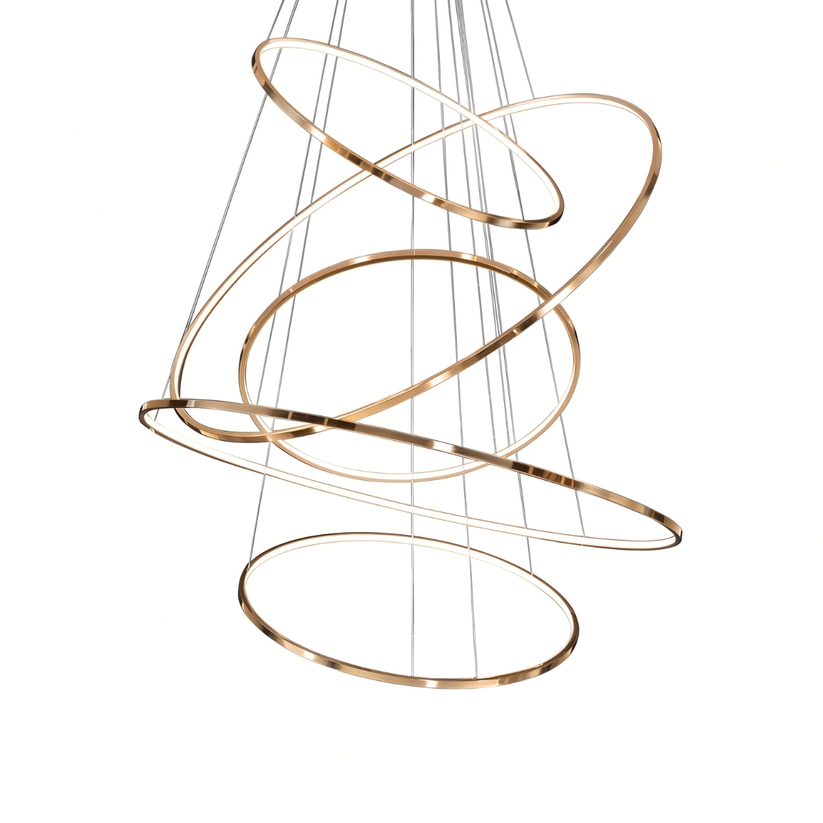 A modern spiral chandelier with interlocking metallic rings in a brushed gold finish, suspended by thin cables against a solid white background.