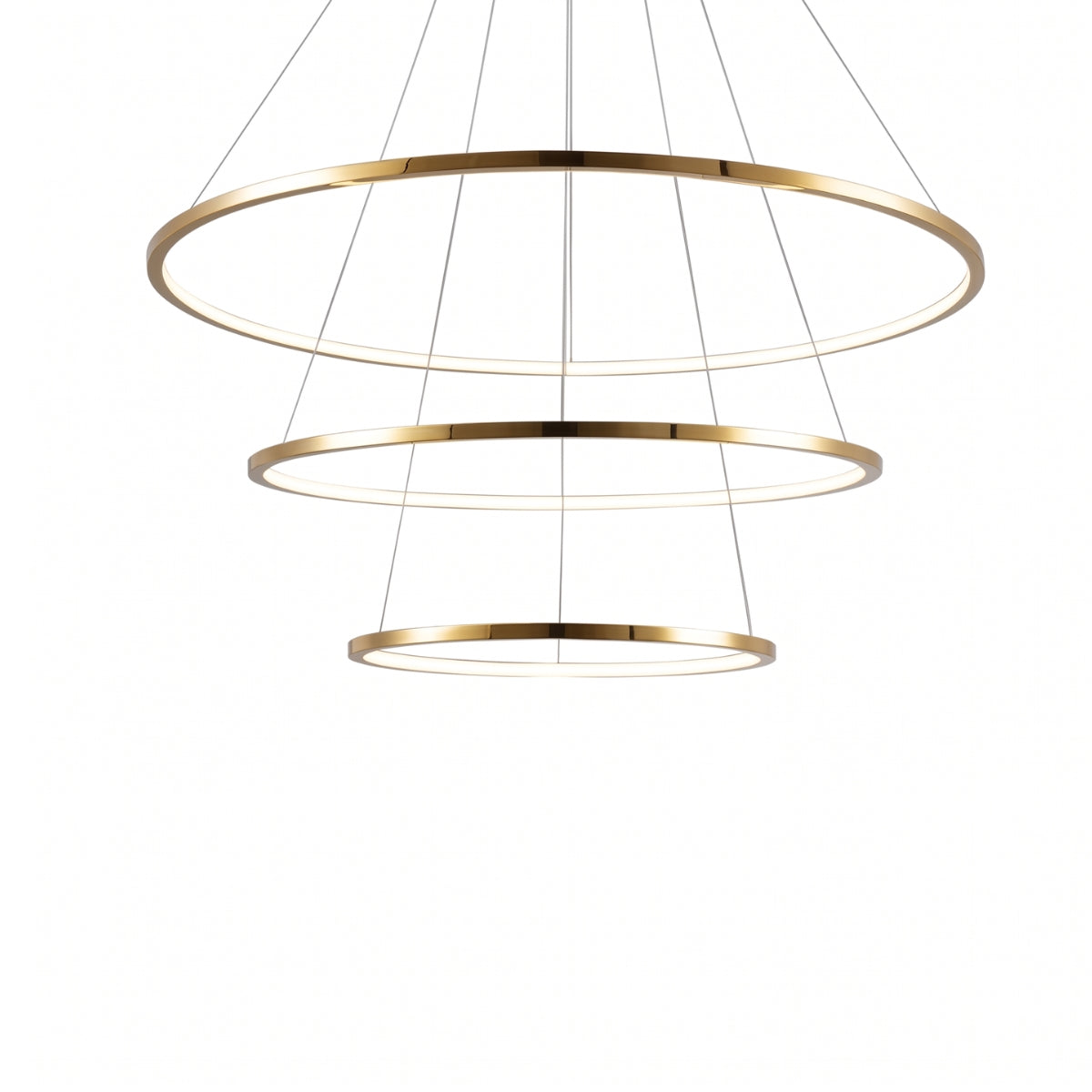 A modern three-tiered linear pendant chandelier with a brushed gold finish and thin suspension wires, shown against a solid white background.