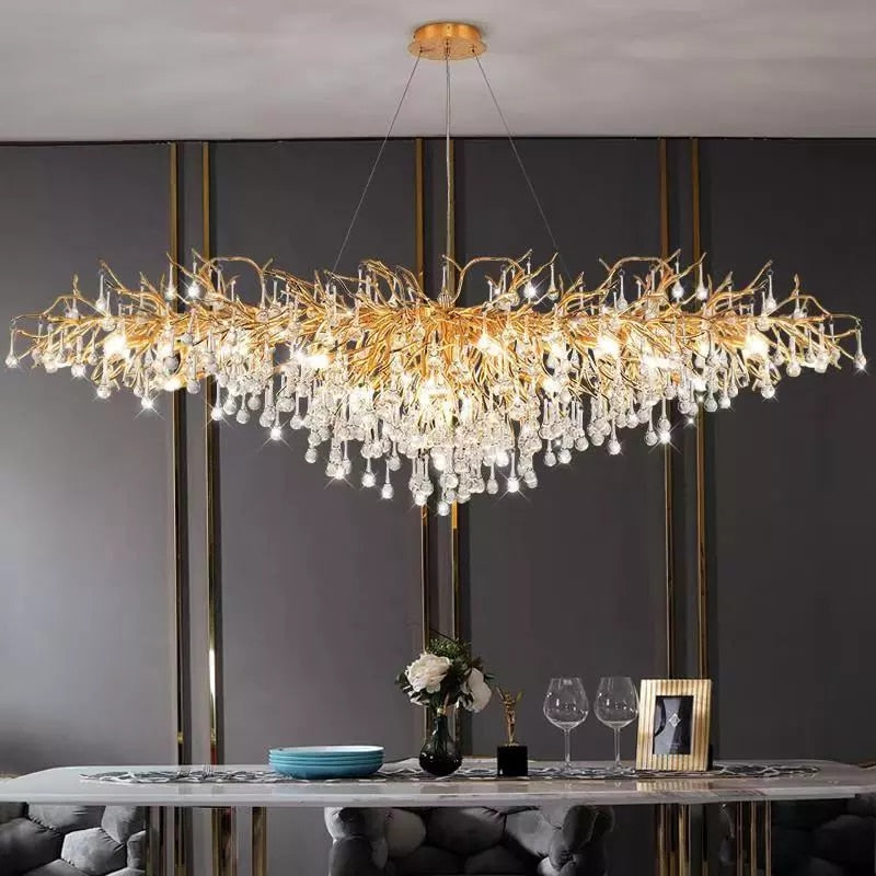 Lights of Scandinavia - ooze - "-What on earth is that majestic being hanging from the ceiling?" Majestic crystal chandelier. Unique lighting for dining rooms, living areas, entrance halls, hotel areas, restaurants, etc. K9 crystals with silver/gold metal plated aluminum frame. - A work of art. 2 sizes - 2 colors L120cm: L120xW50xH35cm, 12-25m2 L160cm: L160xW55xH35cm, 16kg, 15-30m2