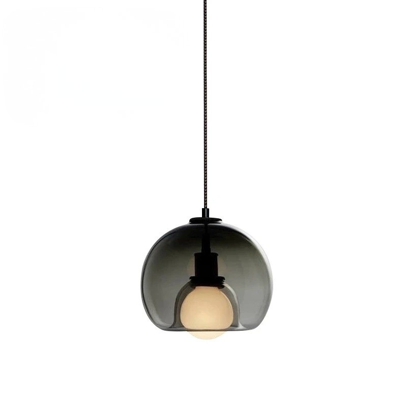 Orbis pendant light with Nordic-inspired glass design casting warm ambient glow for modern interiors