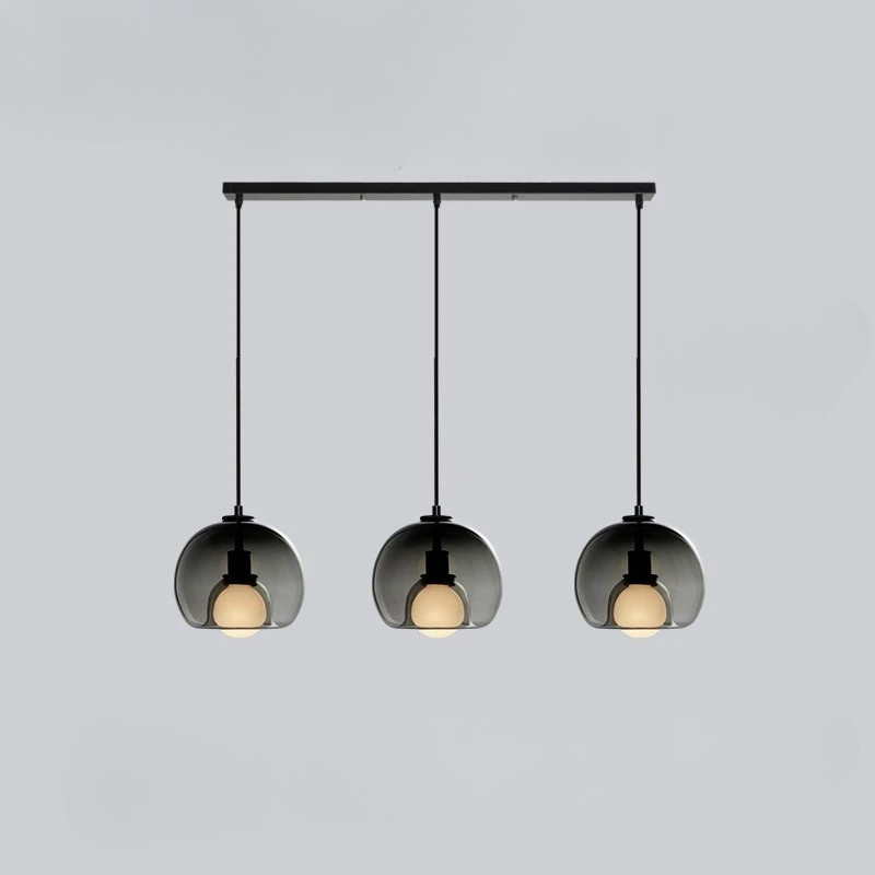 Orbis pendant light with Nordic-inspired glass design casting warm ambient glow for modern interiors